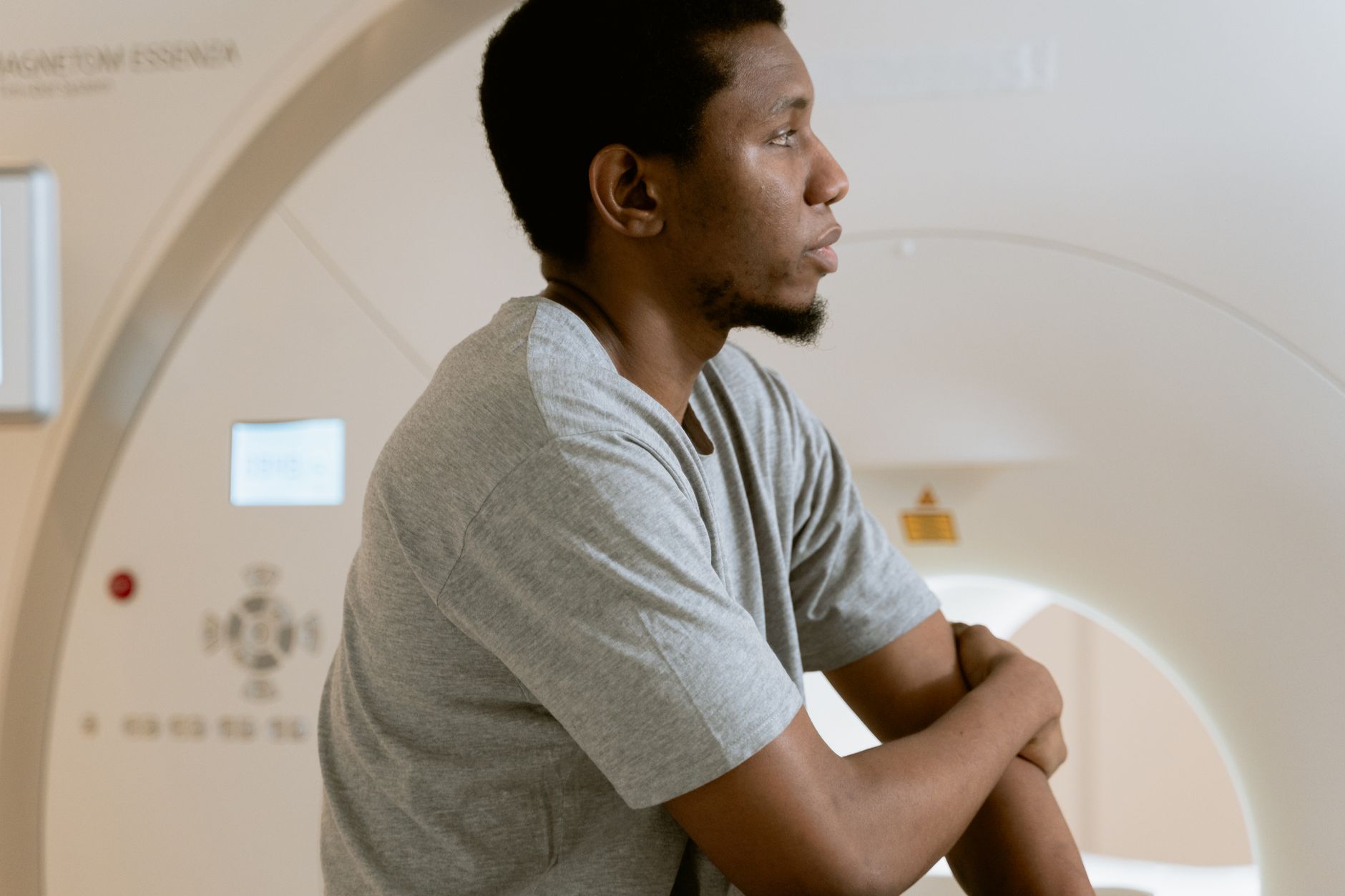 Patient seated in front of a CT scanner